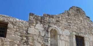 The old stone building of The Alamo in San Antonio, Texas under deep blue skies