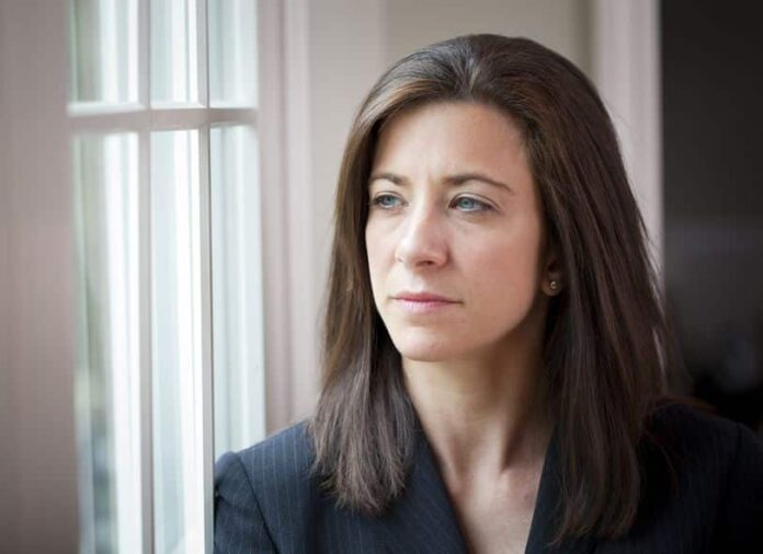 woman thinking about her number that keeps on growing after 4 years of online dating