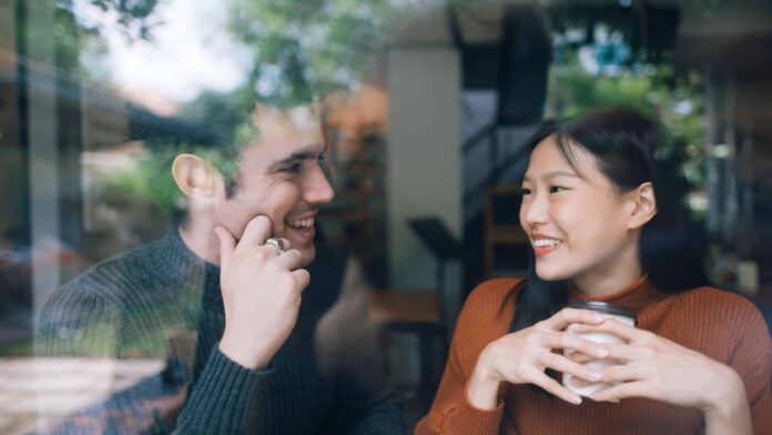 couple talking with each other at a coffee shop