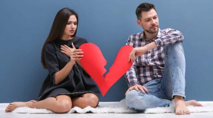 couple holding a broken heart