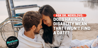 A couple having a romantic date on the beach. The man is handicapped, his wheelchair in the background. The text reads "Ask Dr. NerdLove: Does having a disability mean I won't find a date?"