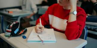 A high school student is focusing in class.
