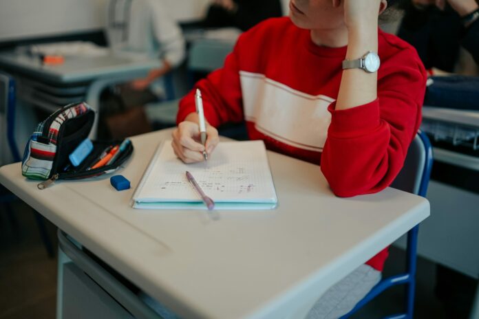 A high school student is focusing in class.